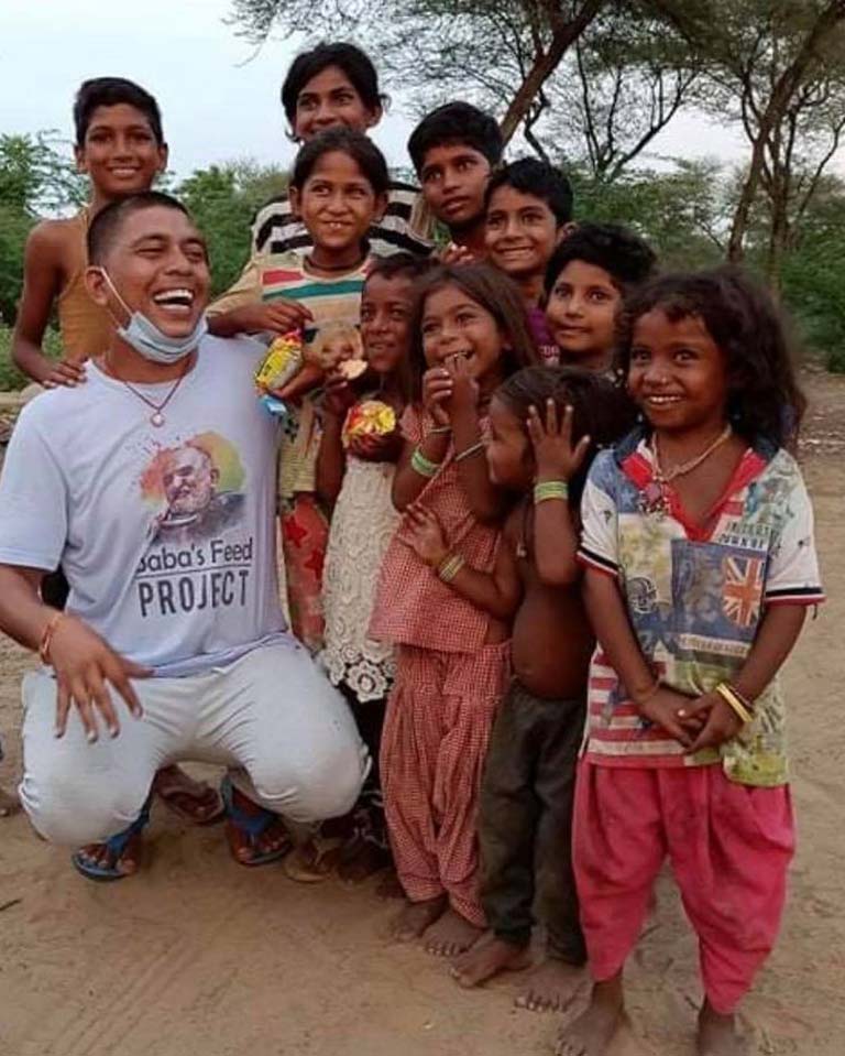 Pintu delights in the children he feeds